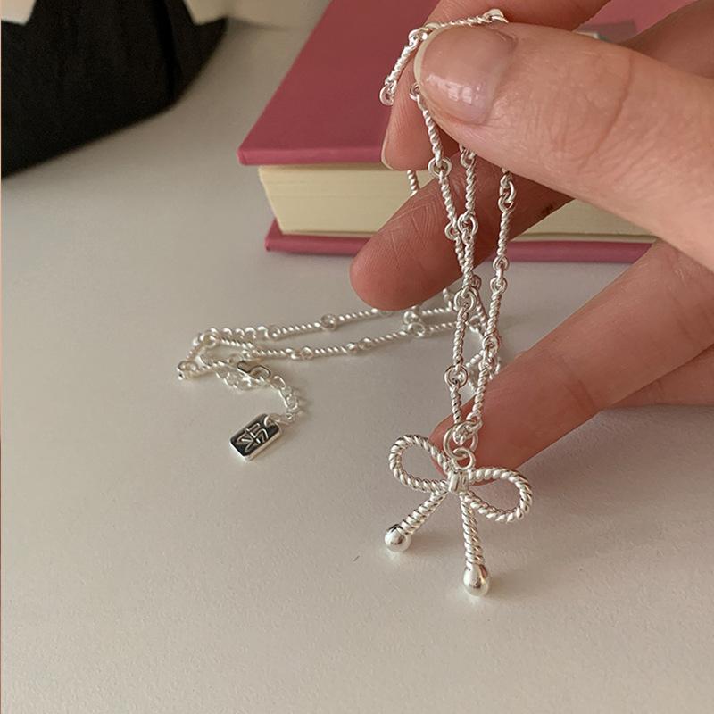 Милое и крутое ожерелье с бантом в виде спирали, женский нишевый дизайн, чувство легкости, роскошь, элегантность, индивидуальность, мода, цепочка на шею, цепочка на ключицу