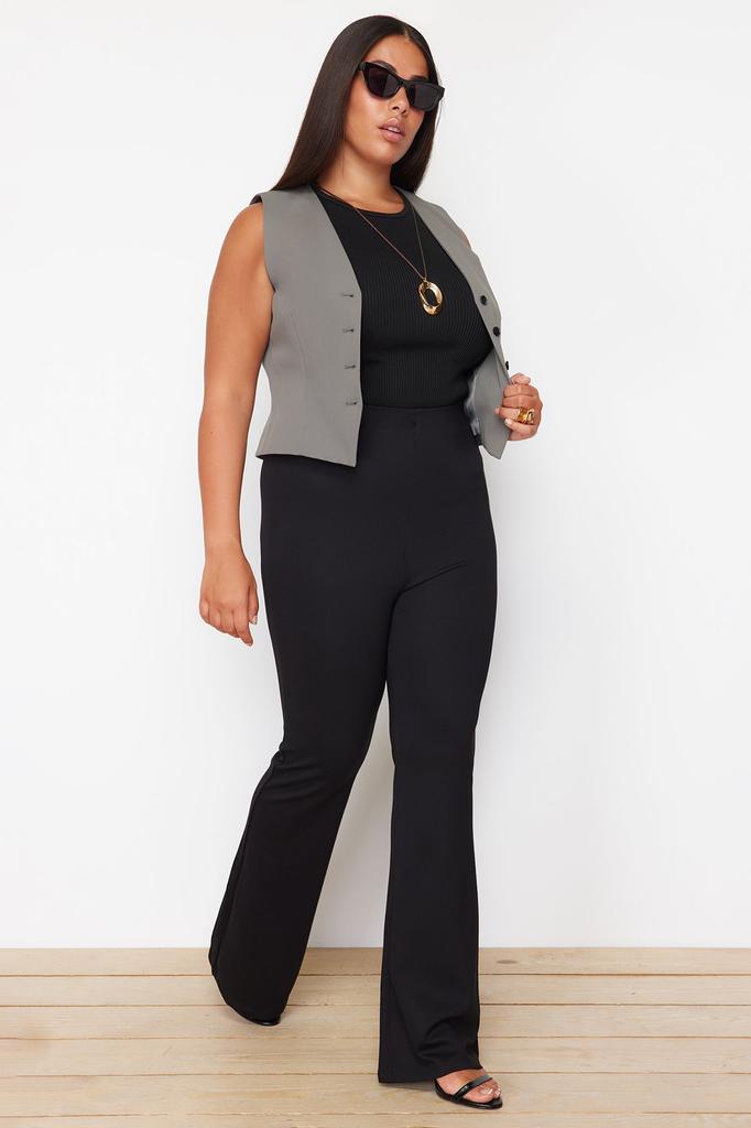 Женские стильные черные трикотажные брюки с расклешенной талией больших размеров для похудения