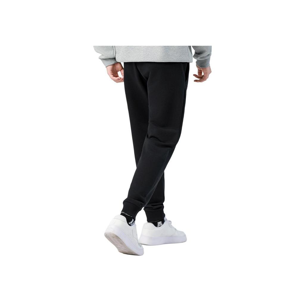 Li Ning Sports Lifestyle Series однотонные свободные брюки с манжетами, влагоотводящие, дышащие, повседневные брюки для мужчин, черные AKLTE51-1