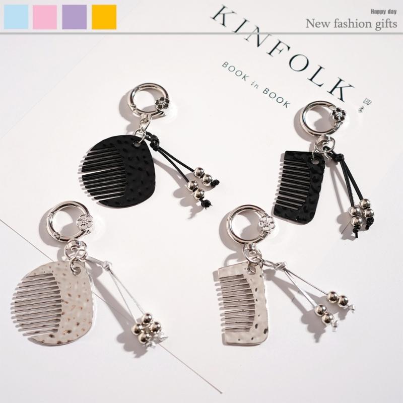 Инновационный брелок-расческа против пушистости Эргономичный дизайн для легкой укладки волос в дороге и стильный аксессуар для ношения