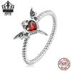 Кольцо-твист из стерлингового серебра S925 «Темные крылья» с красным цирконом в форме сердца