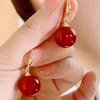2024 French Minimalist Red Pearl Earrings: Elegant Retro High-End Ear Hooks for a Festive New Year