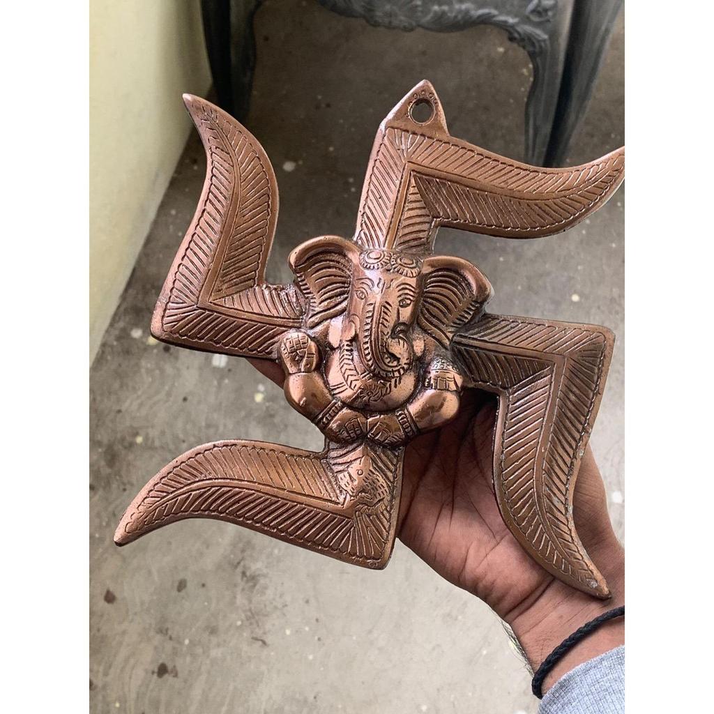 Lord Ganesha On Swastik Metal Wall Hanging (22 Cm X 3 Cm X 24 Cm, Brown)