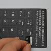 Наклейки на клавиатуру ноутбука с забавными испанскими, английскими и французскими буквами