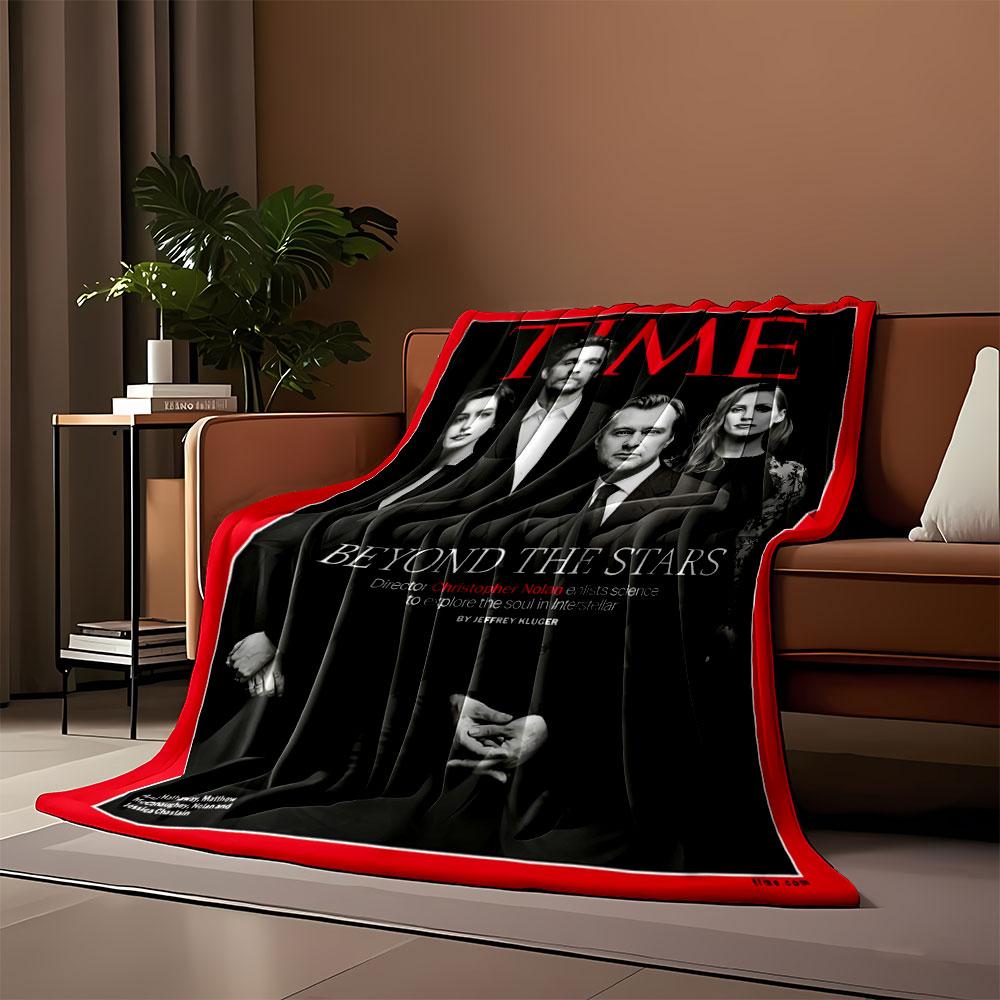 Black-clad group poses formally, surrounded by red border and text. for all seasons blanket lunch break throw gift