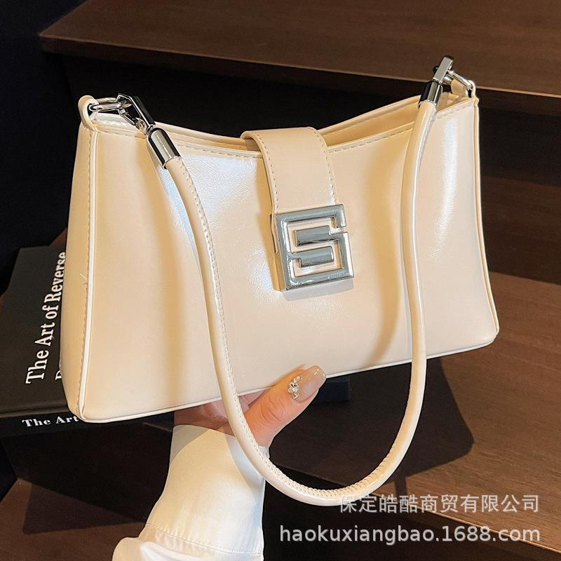 Korean Version of Versatile Bag Women's 2025 Spring and Summer Retro Fashion Baguette Bag Niche High-end Commuter Casual Messenger Bag