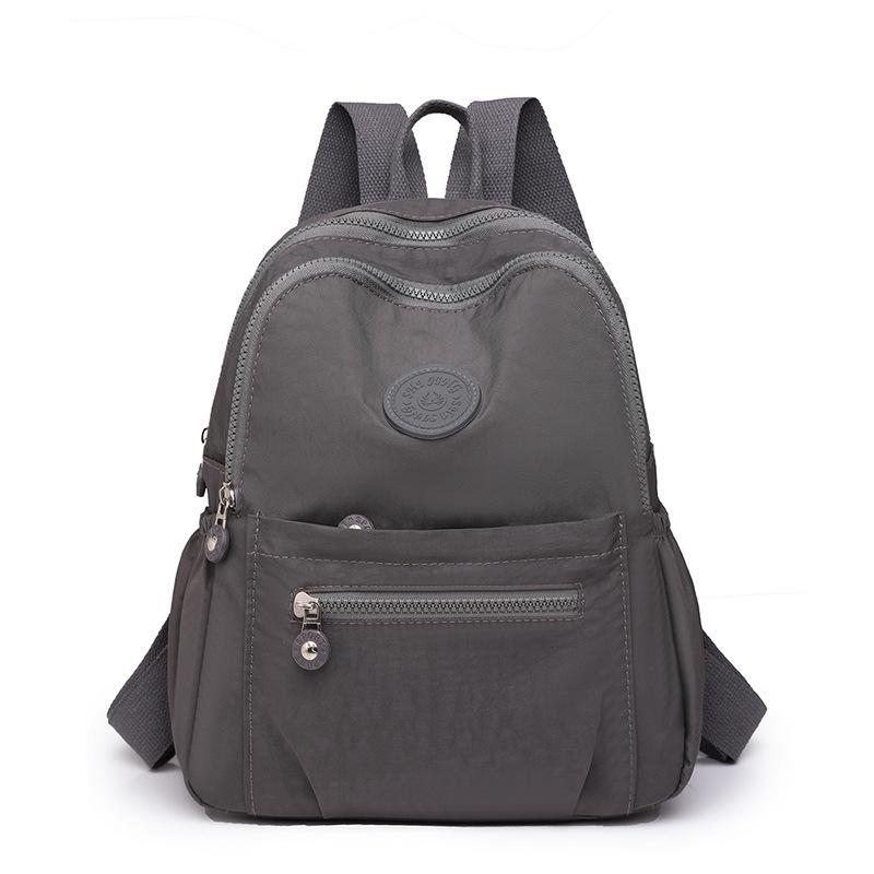 Рюкзак женская сумка нейлоновый рюкзак повседневный тренд дорожная сумка однотонный универсальный большой емкости школьный ранец