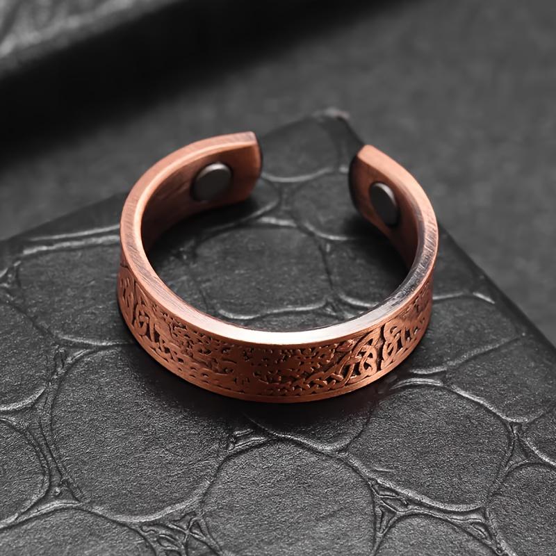 A vintage bohemian-style magnetic open ring adorned with a World Tree motif.