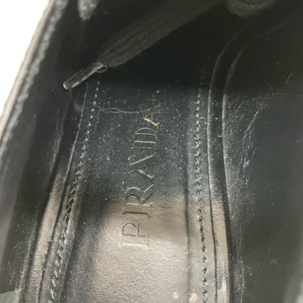 Б/У 186005 PRADA PRADA Лоферы на толстой подошве с крылышками Шнурованные кожаные туфли 1E935G Черная кожа