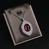 Retro Simulation Colored Treasure Egg-Shaped Hollow Red Steel Jade Inlaid Zircon Pendant