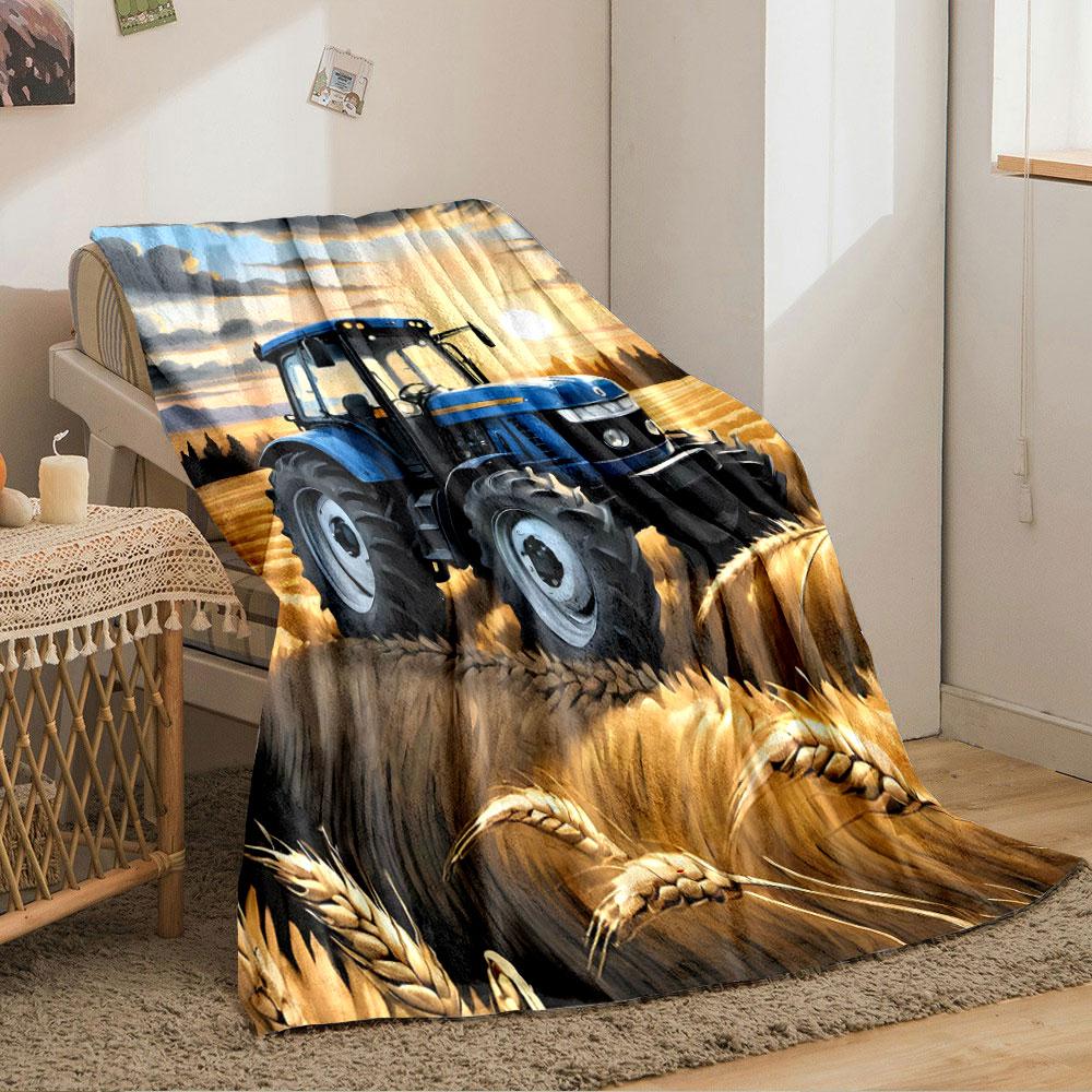 A blue tractor in golden wheat fields under a sunset sky with clouds. for all seasons blanket lunch break throw gift