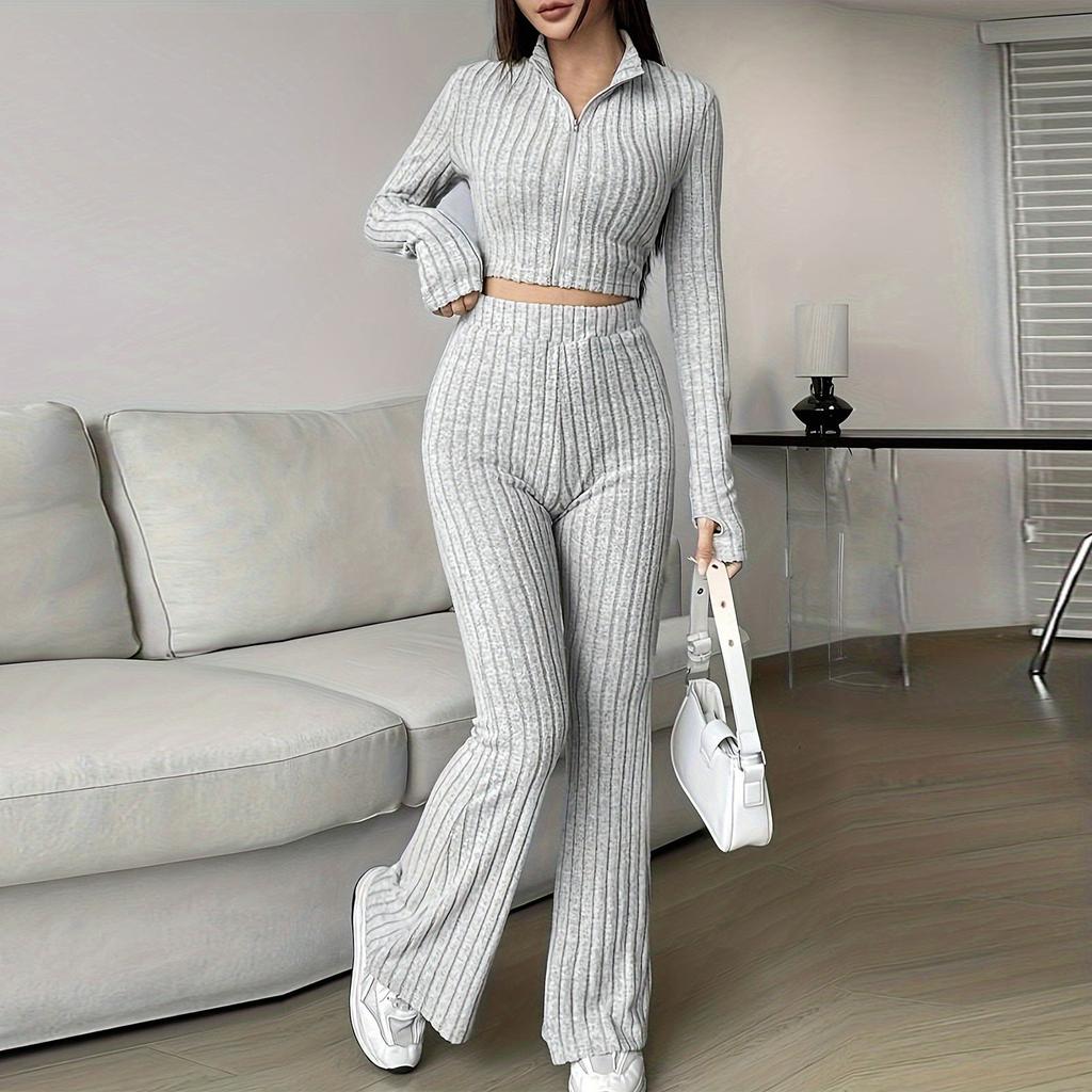 Женский модный однотонный ребристый костюм из двух частей с застежкой-молнией, коротким топом с длинными рукавами и расклешенными брюками с высокой талией