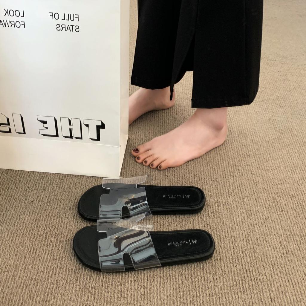 2025 summer new fashion versatile beach vacation flat bottom drag French temperament flat bottom cool slippers transparent word belt