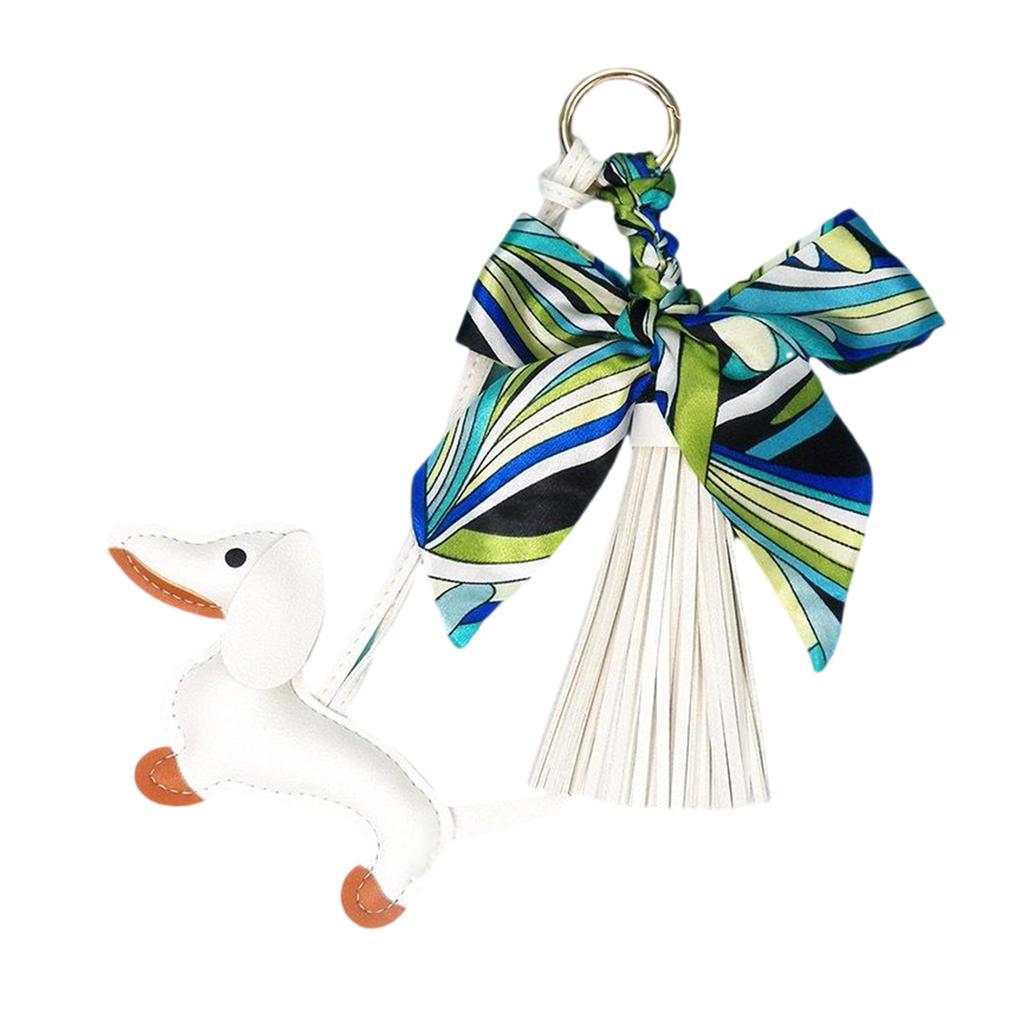 Стильная подвеска в виде таксы с мягкими кожаными кисточками, держатель для ключей с бантом, модный шарм, идеально подходящий для сумок или украшения автомобиля