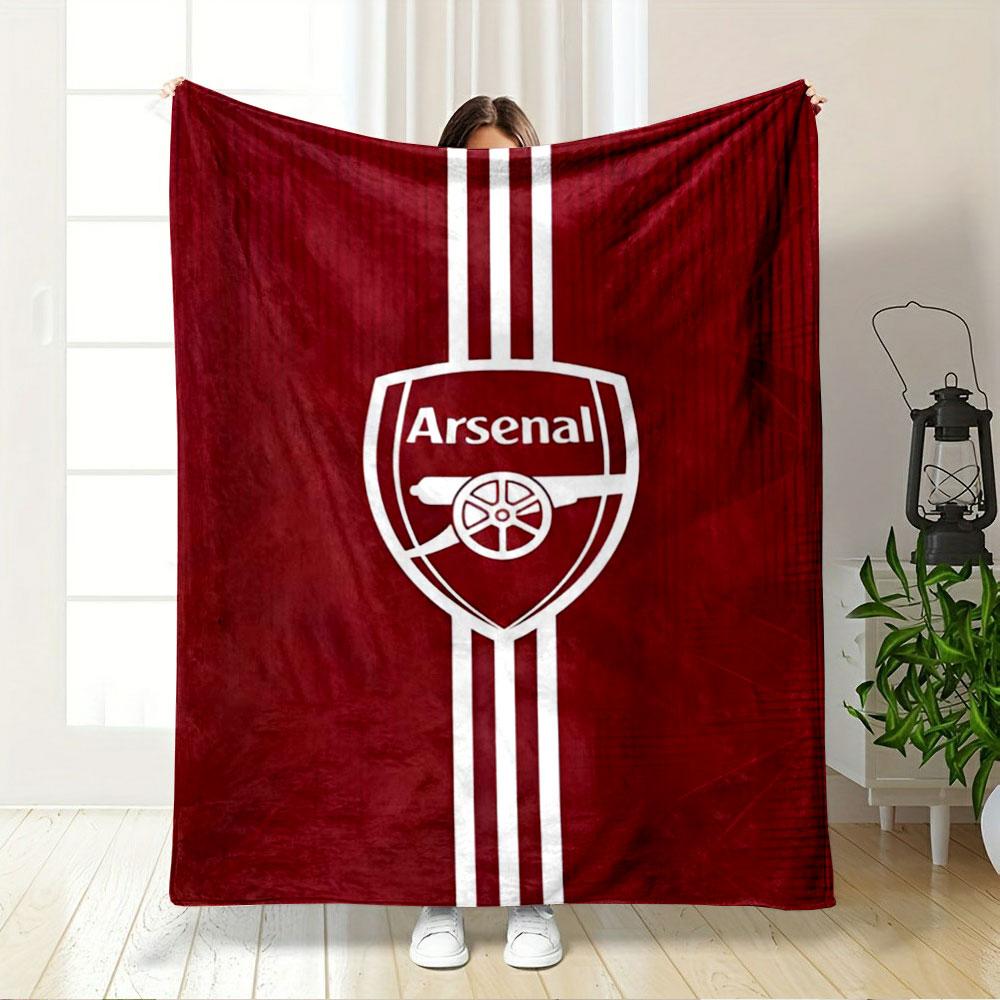 A red background with an Arsenal logo and vertical white stripes. for all seasons blanket lunch break throw gift