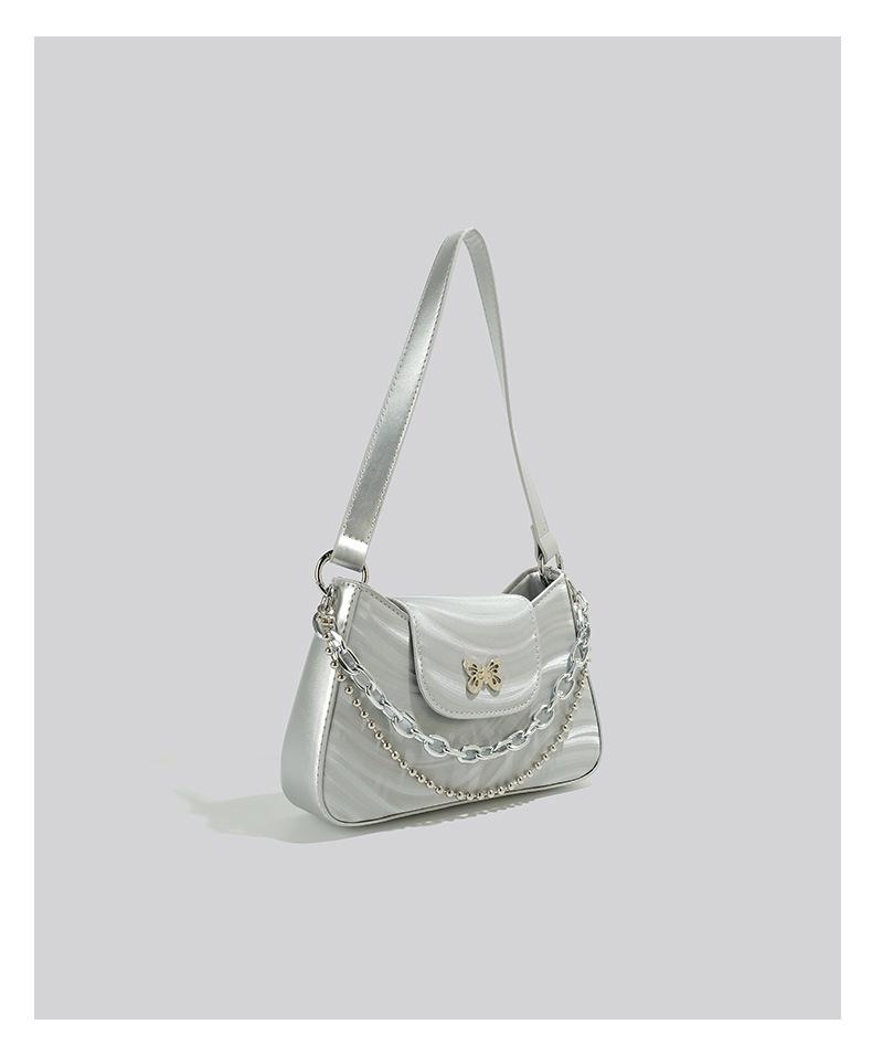 Трендовая женская сумка-багет подмышку 2025 года с высококачественной текстурой и нишевым дизайном