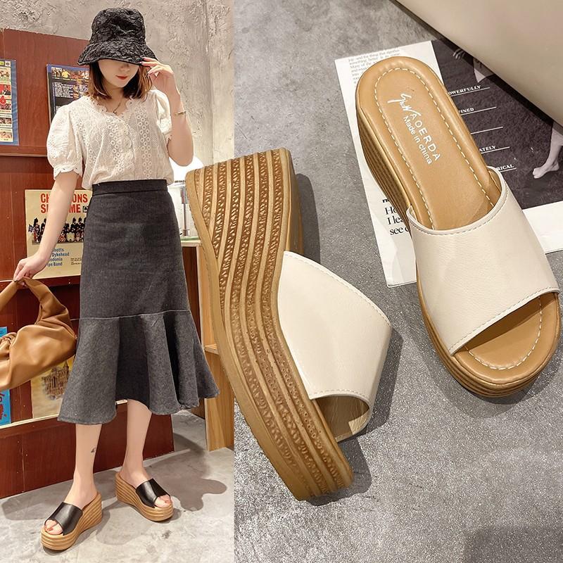 Slope heel cool slippers women's 2025 spring and summer new Korean version thick bottom one word beach women wear muffin bottom slippers