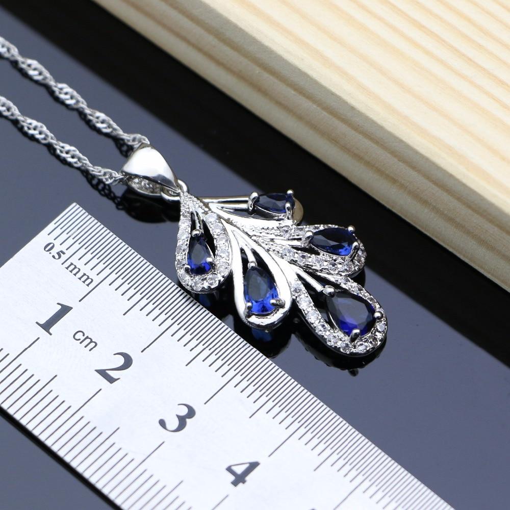 Серебристый ювелирный комплект с синими кристаллами: браслет + ожерелье + серьги + кольцо