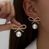 Retro Personality Hollow Bow Design Sense Imitation Pearl Stud Earrings Exaggerated Temperament Versatile Earrings