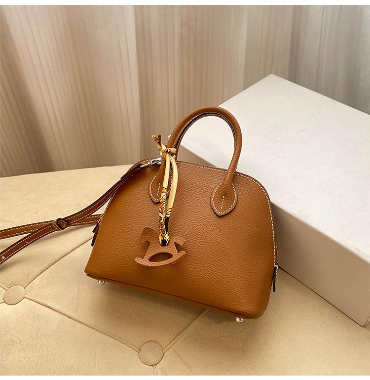 Премиальная мини-сумка-ракушка для женщин 2025 года, новая модная иностранная стильная изысканная сумка для переноски на одно плечо, диагональный пролет, воловья кожа, маленькая