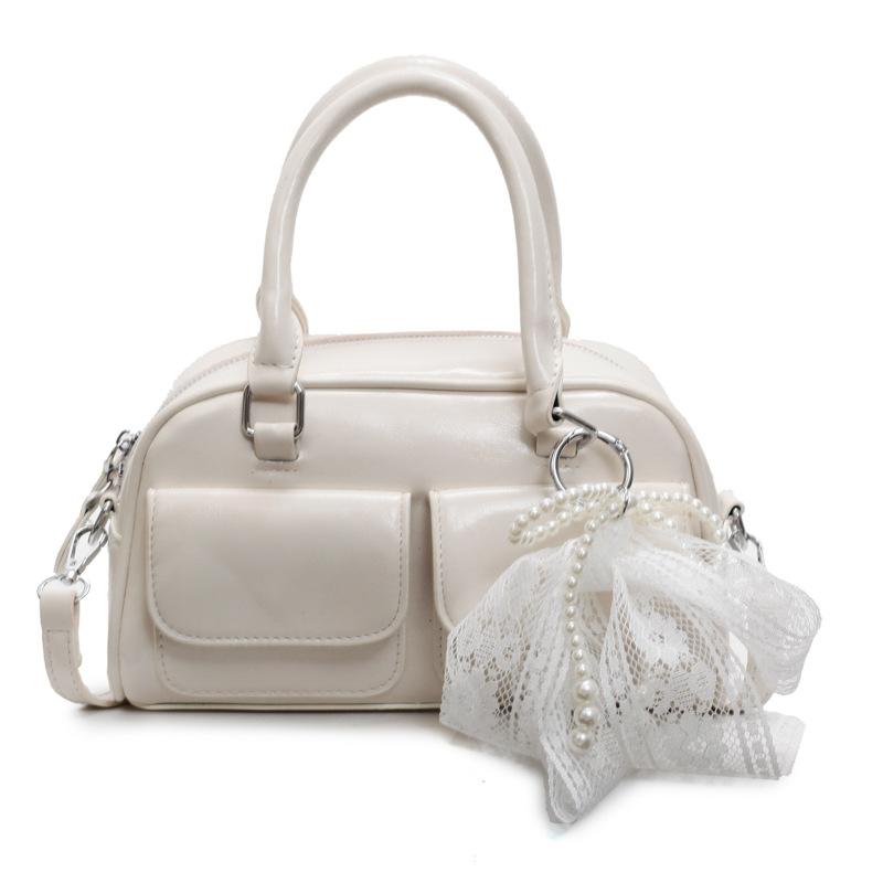 Корейская версия популярной весенне-летней дофаминовой простой портативной сумки-бостонки, нишевая повседневная сумка-мессенджер в иностранном стиле для通勤, женская