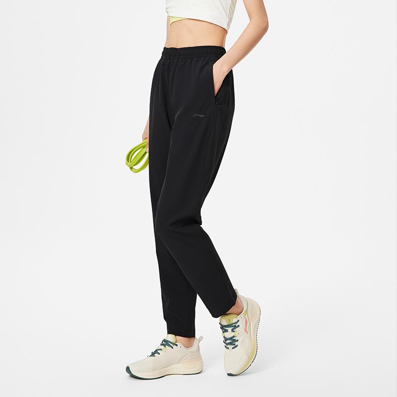 Li Ning Fitness Series однотонные влагоотводящие быстросохнущие прямые трикотажные спортивные брюки женские брюки черного цвета AYKU468-1