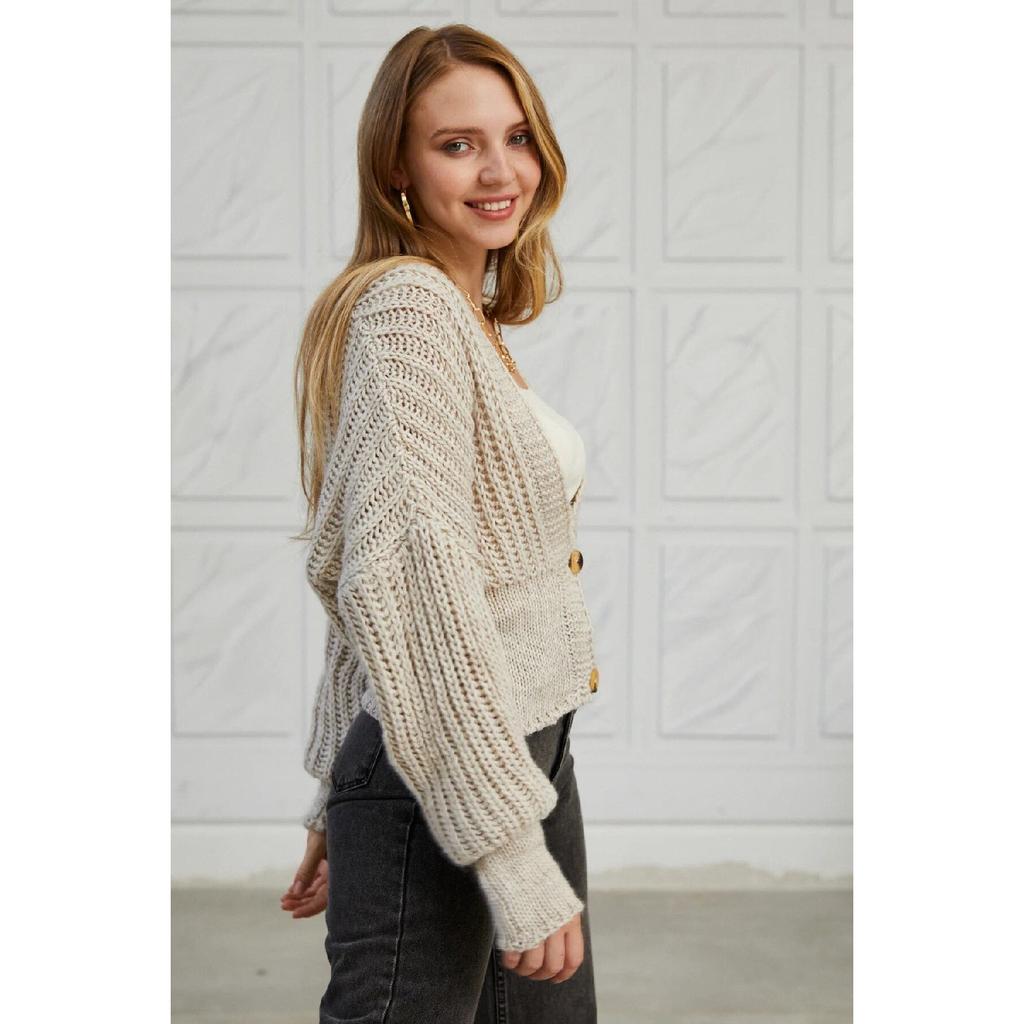 Женский трикотажный свитер с регулируемым узором и завязками по бокам