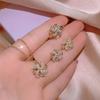 Rotating Pinwheel Earrings Female Diamond Studs Three Piece Set of Korean Character Rings