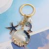 Брелок с жемчугом и дельфином, модные подвески на морском пляже, новый брелок с ракушкой и звездой унисекс