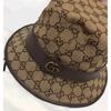 Б/у соломенная шляпа-ведро GUCCI GG коричневая размер M