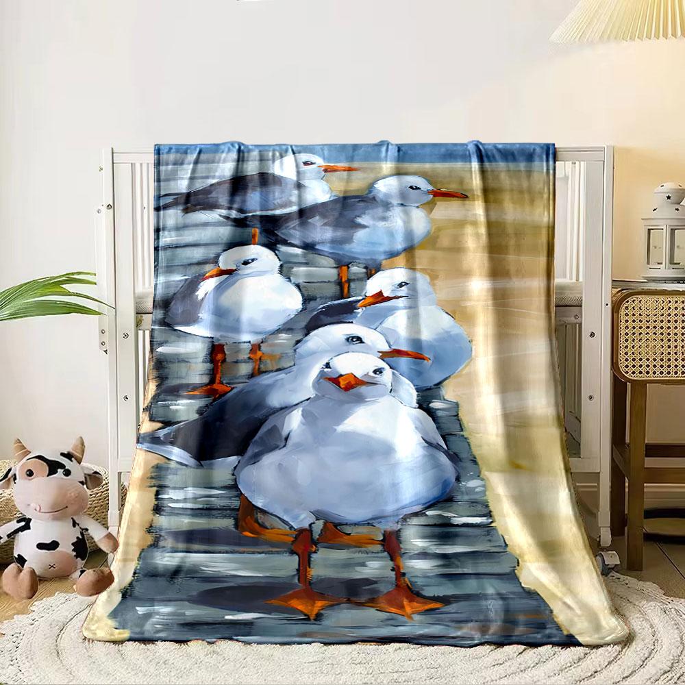 Seagulls with white and gray feathers standing on a wooden walkway. for all seasons blanket lunch break throw gift