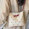 Korean niche bow women's bag 2025 new summer shoulder armpit bag fashionable high-value portable bucket bag
