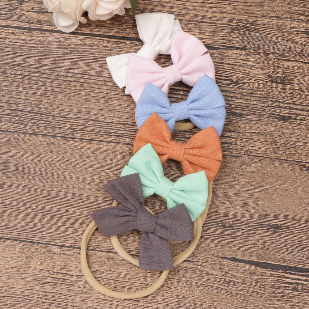 Комплект детских повязок на голову из нейлона и хлопка: Повязки на голову из льна и банта в подарочной коробке.