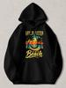 Black Pullover Hoodie with Vintage Sunset Beach Graphic, Palm Trees and Hammock Design, "Life Is Better At The Beach" Text Print,