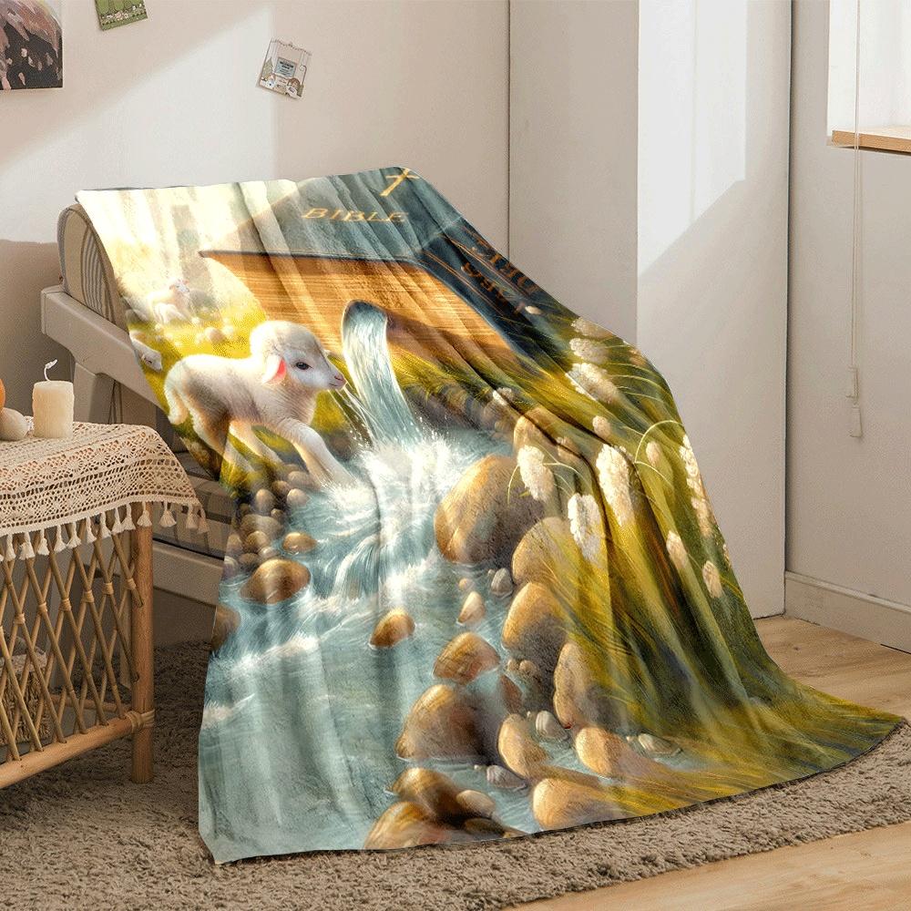 A Bible pours water into a stream with lambs grazing in a serene field. for all seasons blanket lunch break throw gift