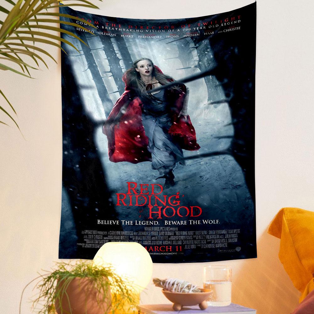 A woman in a red cloak running through a snowy, shadowy forest. Patterned tapestry for bedroom and living room home decor