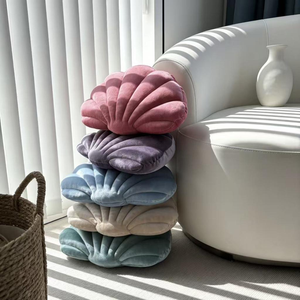 A seashell-shaped pillow, suitable for living room sofas, bedrooms, offices, and home decor.