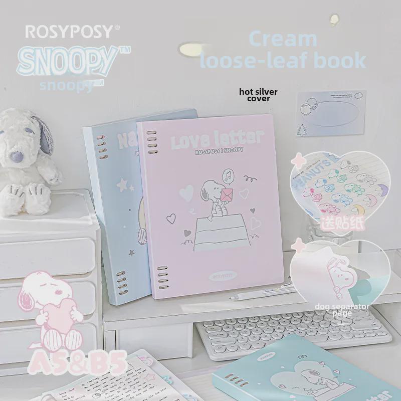Блокнот в мягкой обложке RosyPosy Snoopy: Кремовый блокнот с цветными страницами, наклейками и горизонтальными линиями.
