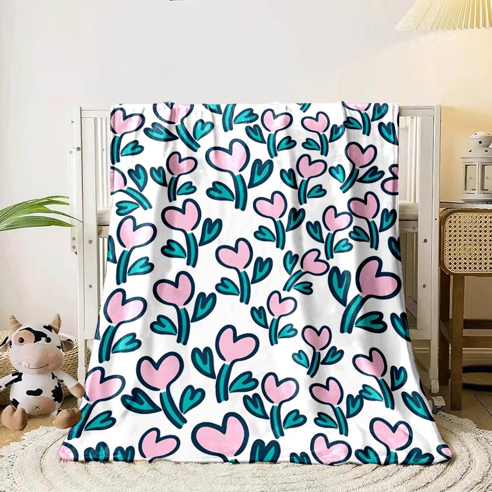 Pink heart-shaped flowers with teal leaves on a white background. for all seasons blanket lunch break throw gift