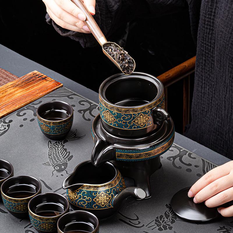New Chinese lazy stone grinding semi-automatic tea set stone grinding ceramic retro gilt printing tea set small gift