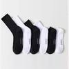 Черно-белые однотонные спортивные носки: Амортизирующий, простой и универсальный для баскетбола и бега.