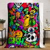 Vibrant graffiti collage featuring cash, skulls, aliens, and playful icons. for all seasons blanket lunch break throw gift