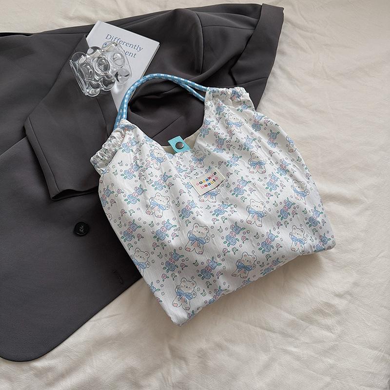 2025 printed new large-capacity commuter bag hand bag Korean version shoulder bag female student cute canvas bag