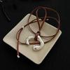 Brown Leather Cord Necklace with Silver Abstract Human Body Pendant – Autumn/Winter Light Luxury Clavicle Chain