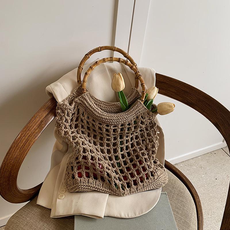 Ручная плетеная сумка женская корейская версия ins модная простая повседневная соломенная сумка 2025 нишевая высококлассная ажурная женская сумка