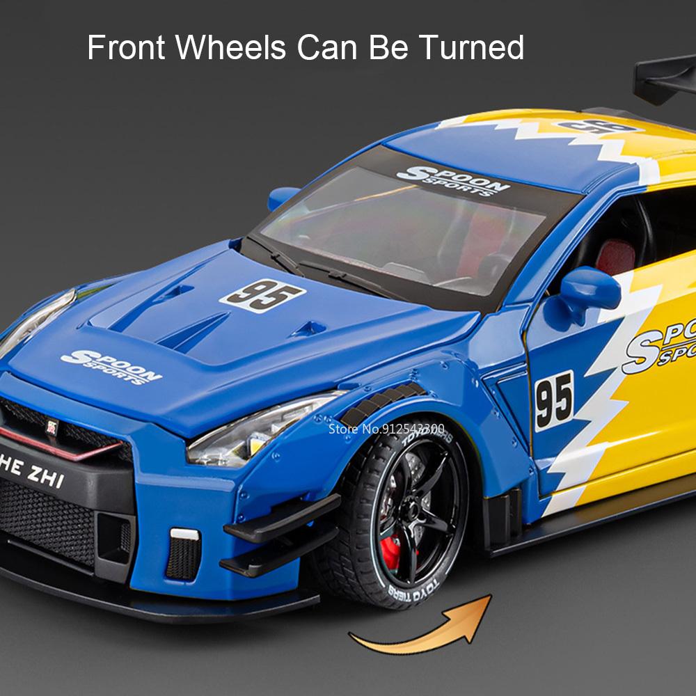 1:Модель спортивного автомобиля GTR R34 в масштабе 1:24, литая из сплава, с открывающимися дверями, с механизмом оттяжки, звуком и светом. Подарок для ребенка
