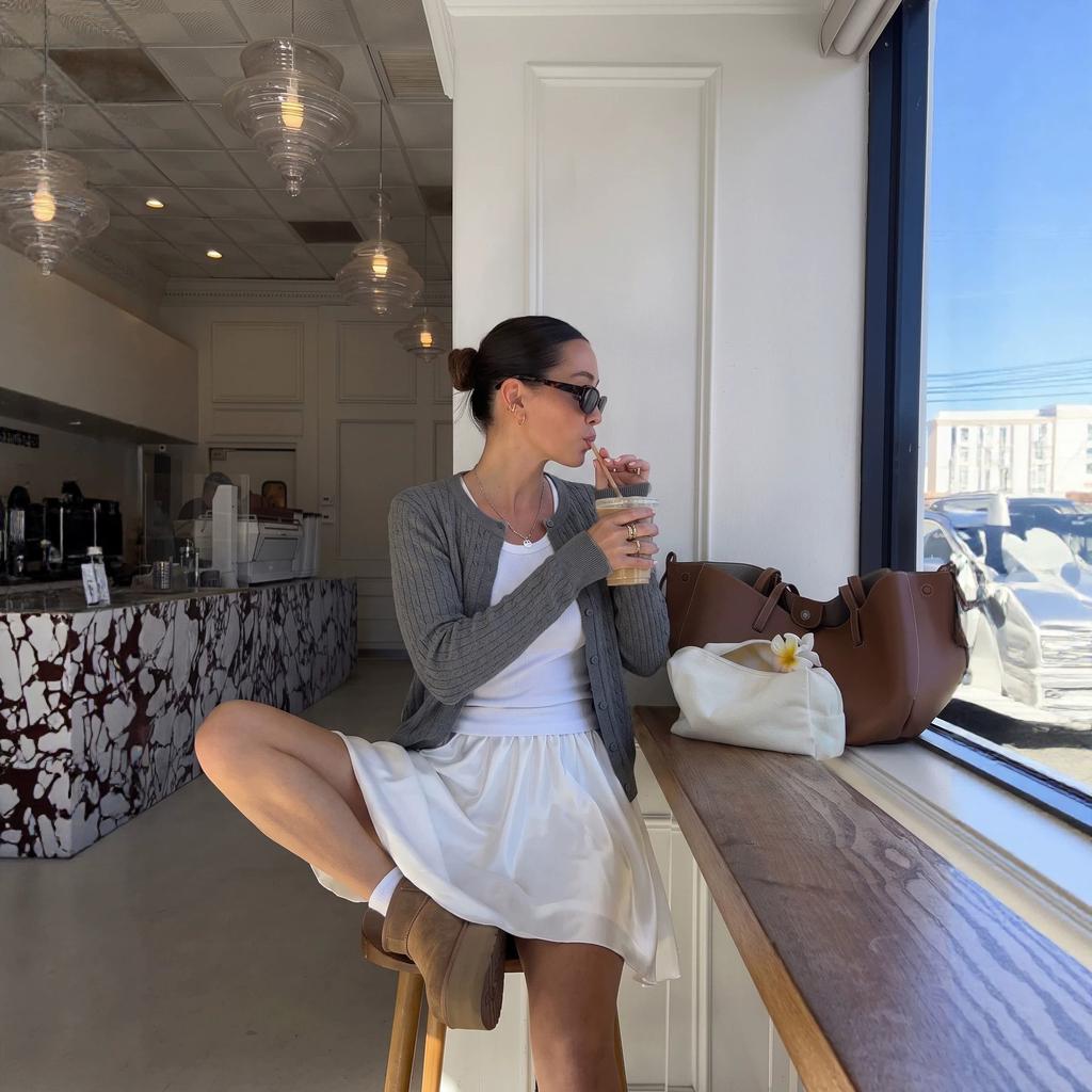 European and American women's clothing solid color twist knitted cardigan women's short long-sleeved round neck knitted top jacket