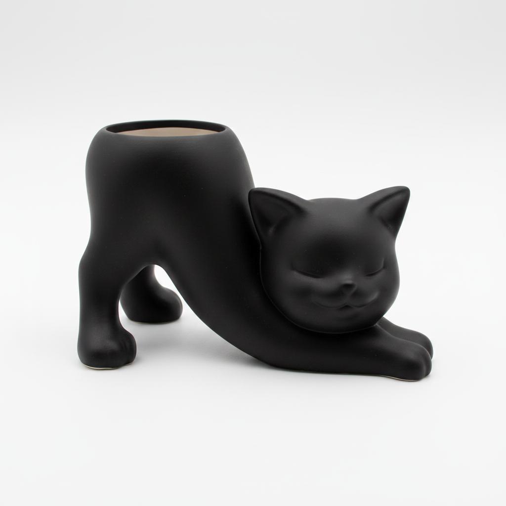 Black flowerpot in the shape of a stretching cat for succulents and cacti