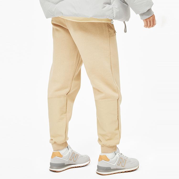 New Balance Спортивные брюки женские хаки средние AWP14374-HNA