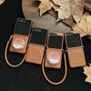 Коричневый кожаный противоударный чехол для Samsung Z Flip7 с ремешком против потери и магнитной застежкой